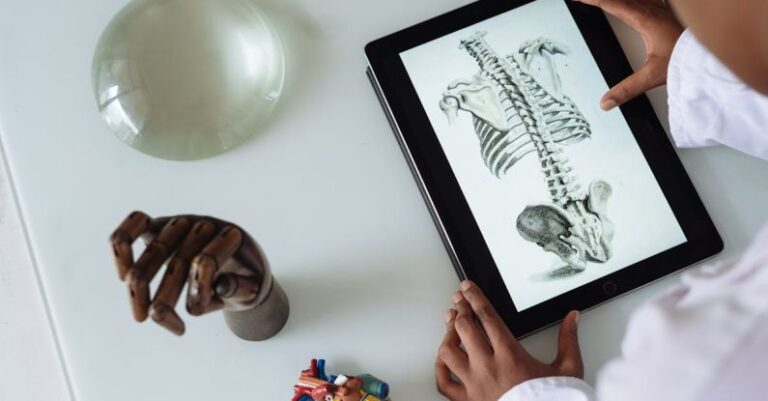 Material Science - Unrecognizable African American scientist studying anatomy with tablet