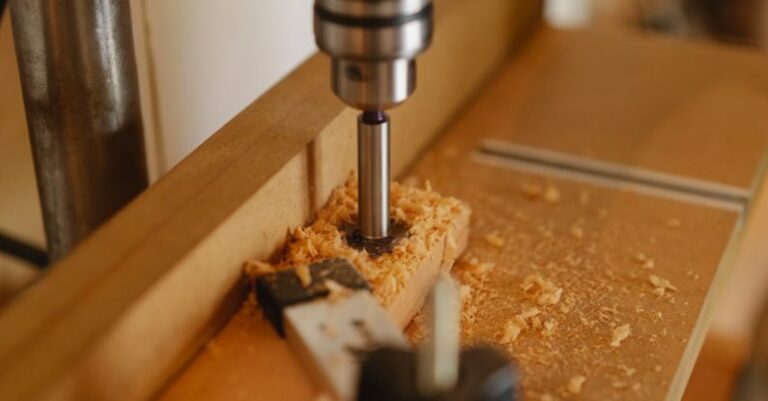 Workplace Automation - Boring machine drilling hole in wooden plank
