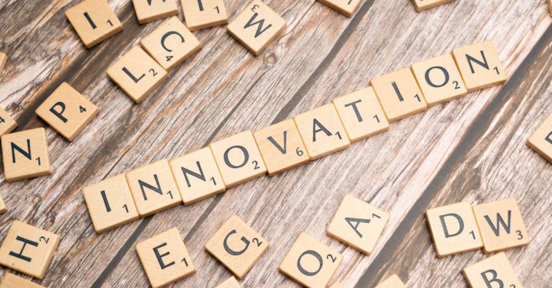 Breakthroughs - The word innovation spelled out in scrabble tiles
