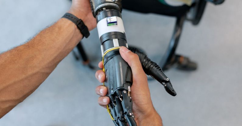Robotic Assistants - Person Holding Prosthetic Arm