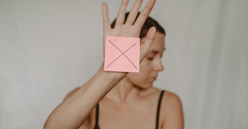 Gesture Control - Woman with paper with cross sign